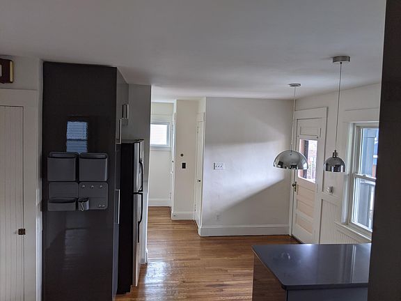 Dining area with overhead lighting, door to front porch