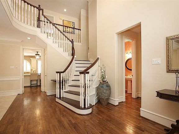 Welcoming foyer with gorgeous wood floors