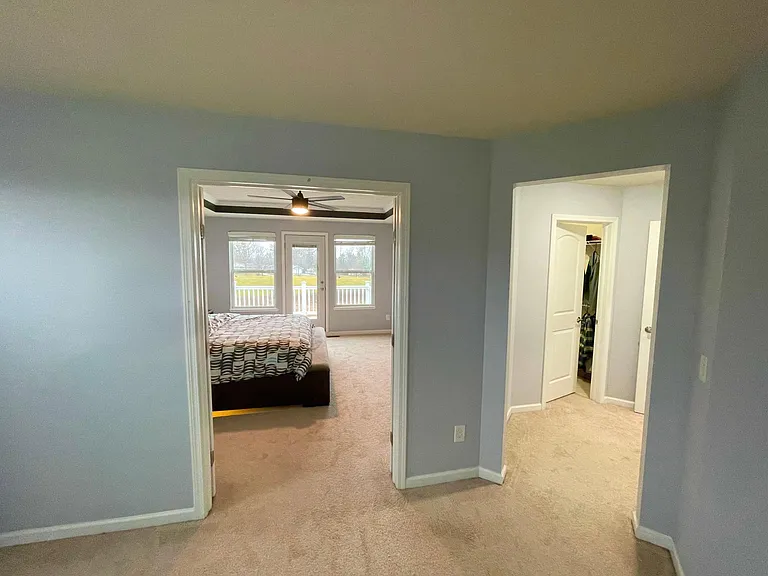 Owners bedroom entrance and closet from owners retreat