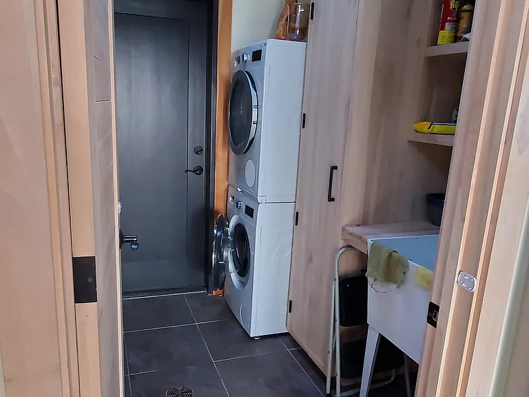 Kitchen into mudroom, laundry, pantry space