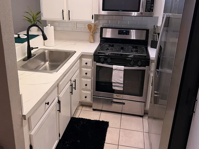 Kitchen with stainless steel appliances and new counter tops