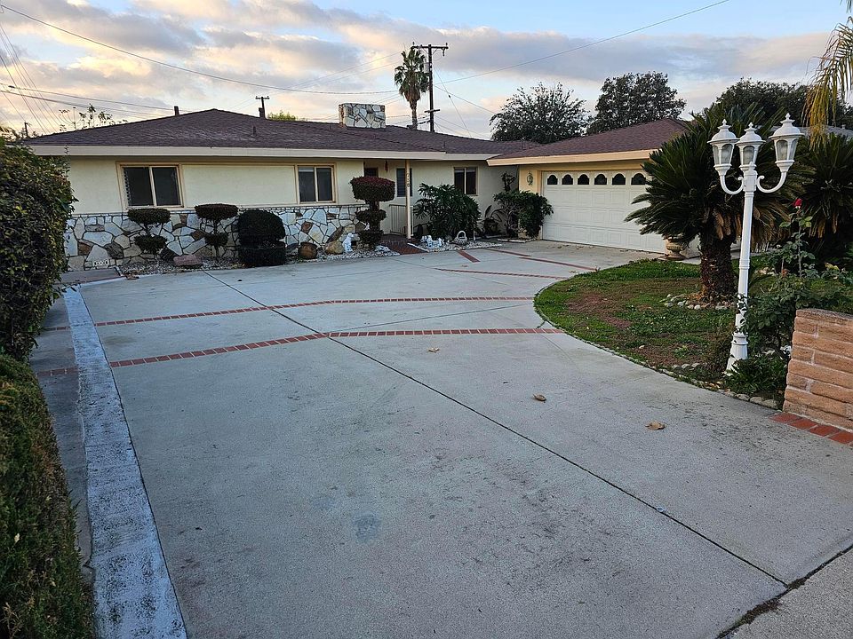 Front of home with Parking galore.