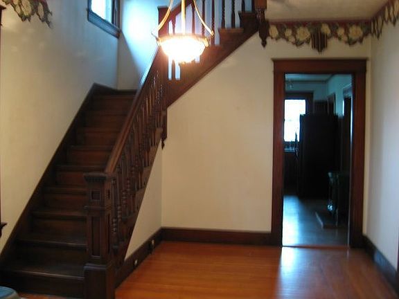 Glamorous entry featuring Natural woodwork
