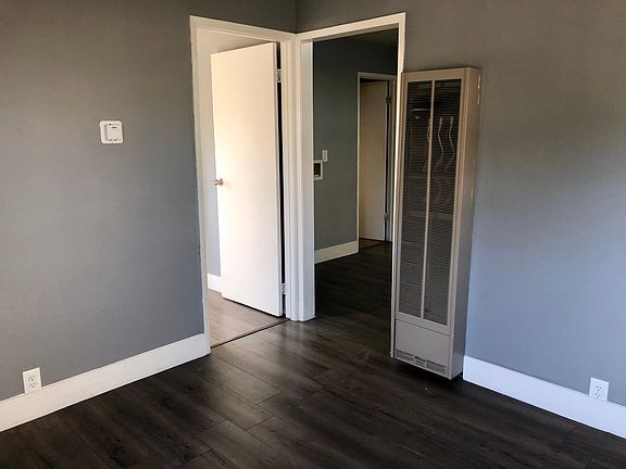 Living room (bedroom 1 is the left door and kitchen is the right door)