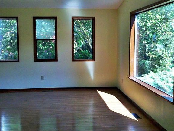 The Living Room is spacious and has had a recent face lift to include New Malcon - Builders grade 3/4" T&G Oak flooring and refinished & stained trim along with newly painted interior walls. There is a full blown view of Mt Baker though the Easterly facing windows.