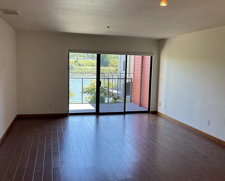 Photo of unstaged living room and dining room