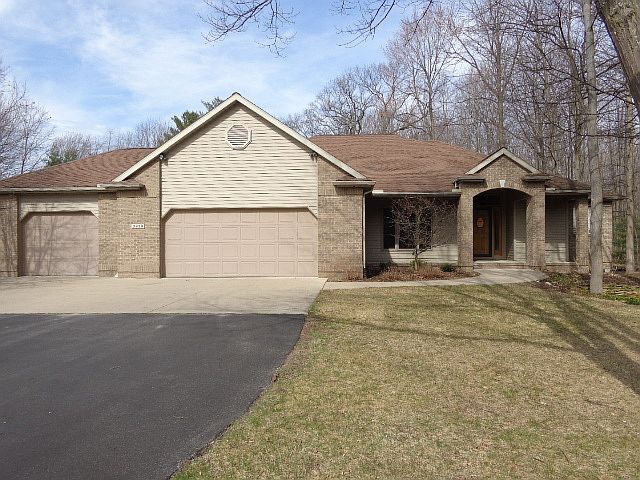 FABULOUS FIVE BEDROOM HOME!! Beautiful woodland views and privacy on this one acre lot. Desirable 3 