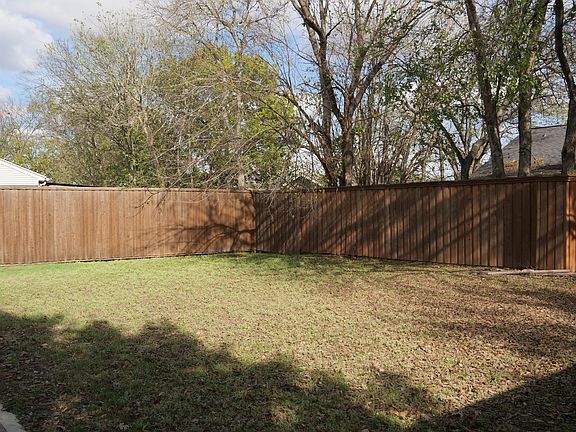 Large privacy-fenced backyard in historic neighborhood