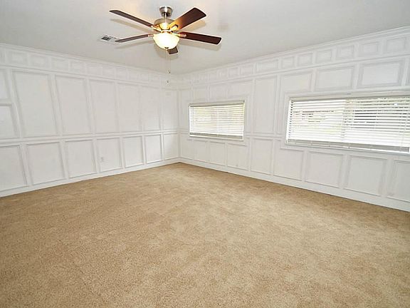 A pool table would fit easily ion this room!