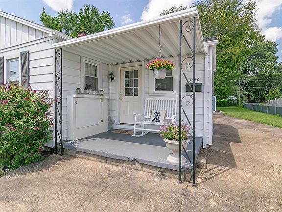 The covered front porch is a perfect spot to enjoy your morning coffee or evening glass of wine.