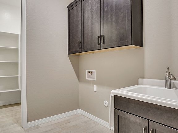 Laundry with cabinets closet