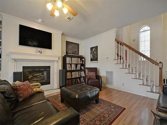 Another view of the downstairs family room, built-ins to the left of fireplace.
