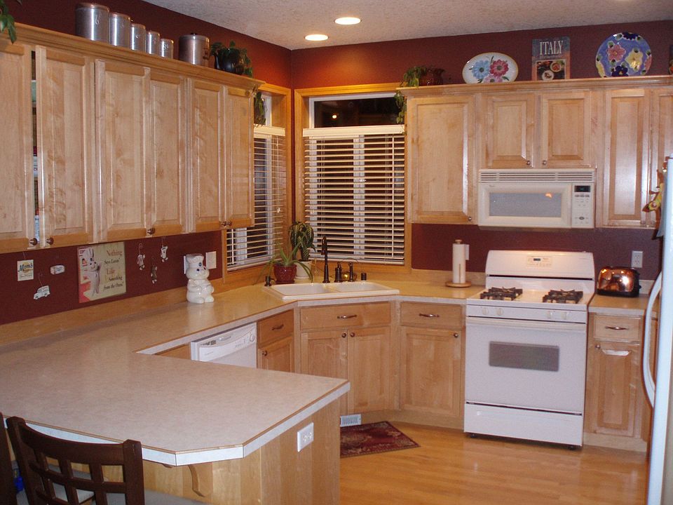 Solid maple cabinets, gas range and oven with micro-hood. 