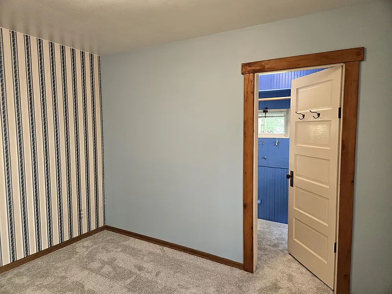 Back Bedroom looking into Powder Room and Closet area.