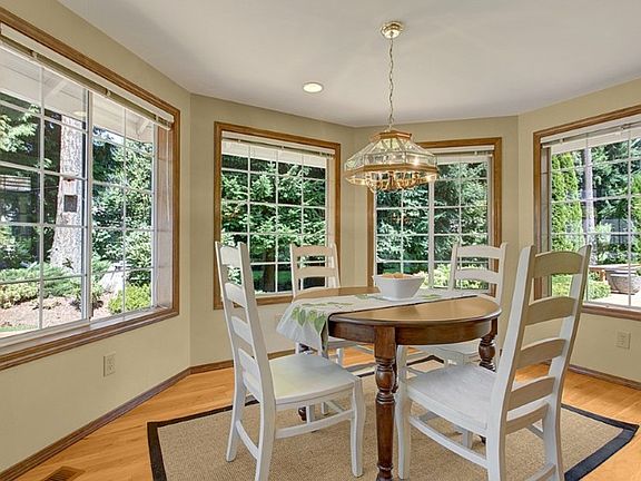 Enjoyable eating area next to kitchen and family room over looking wonderful, landscaped yard.