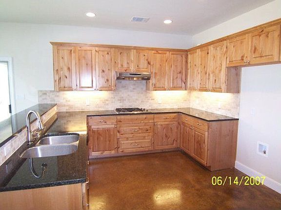 Kitchen w/ granite counters and tile floors!