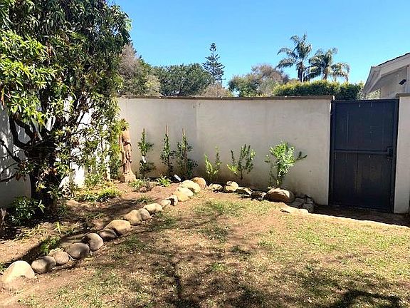 Front Yard Area with Side Gate to Garage/Driveway