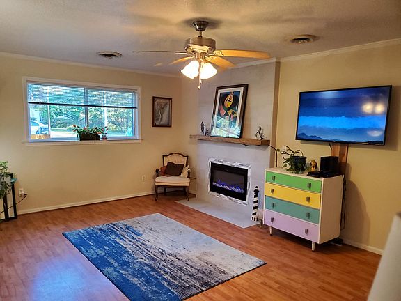 Large living room with sunny exposure and electric fireplace. 19'x14'