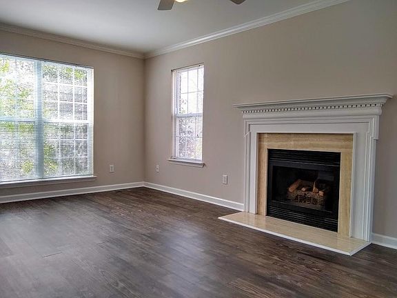 Another view of the living room. Lots of windows and natural light.