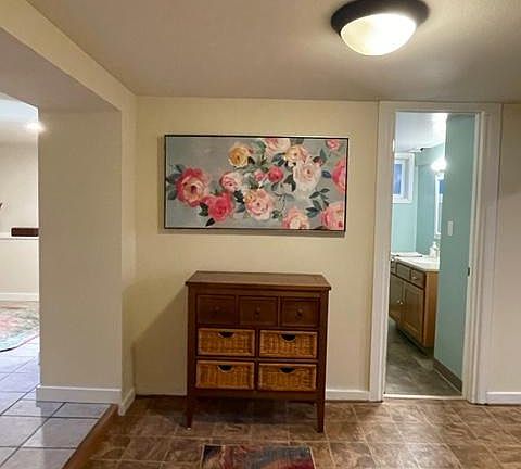 Entryway bedroom is to the left, bathroom door is straight ahead