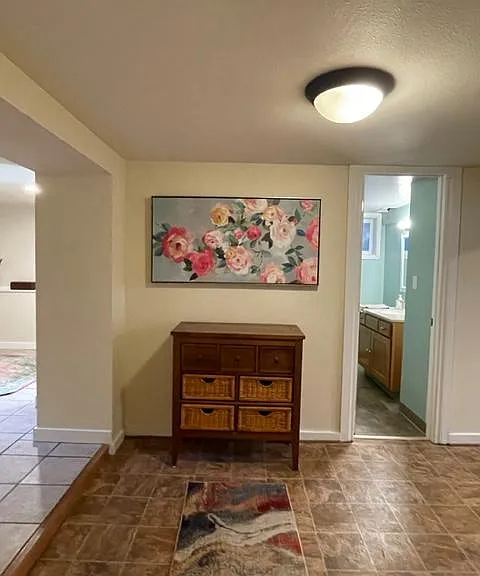 Entryway bedroom is to the left, bathroom door is straight ahead