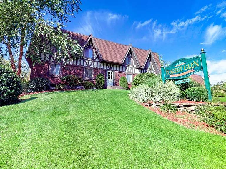 Mature trees, colorful seasonal landscaping, impeccable lawn!