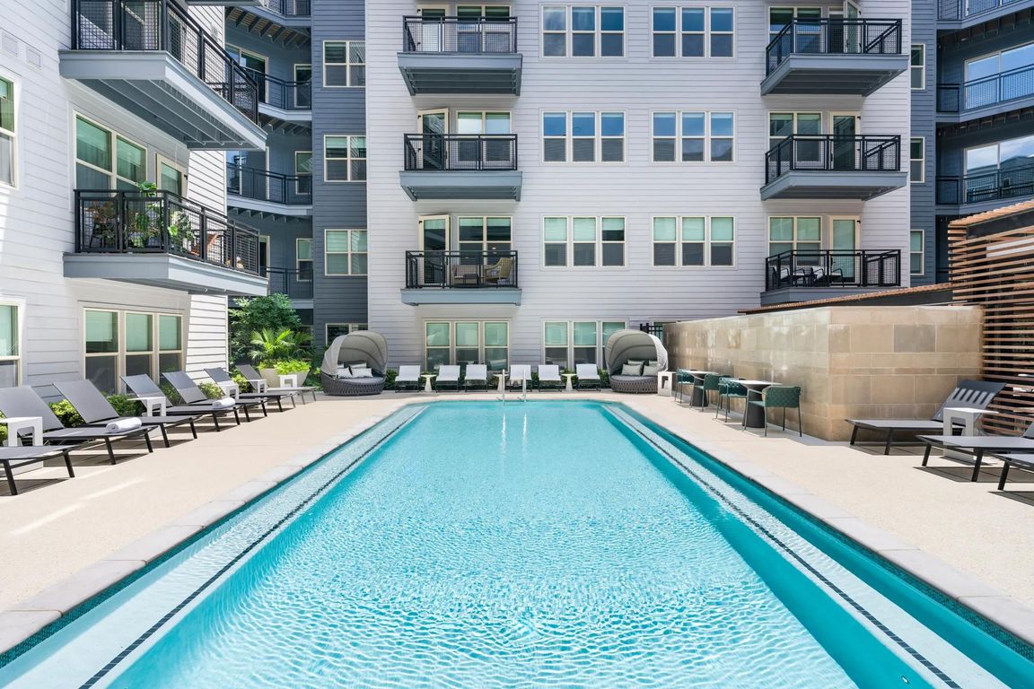Soak up the sun or cool off in the crystal-clear pool_this courtyard oasis is your personal retreat, perfect for relaxing or entertaining.