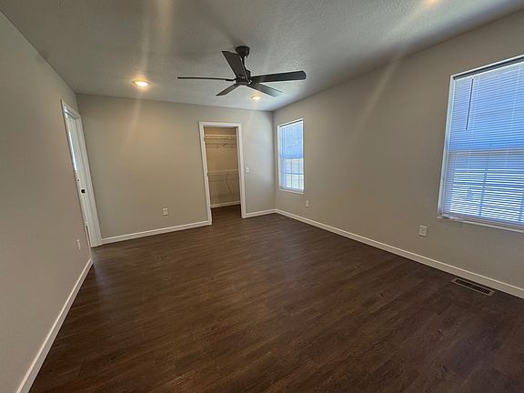 Primary bedroom with walk-in closet