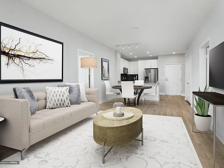 Renovated Package I kitchen, living, and dining areas with hard surface flooring