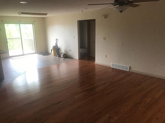 Living room, Dining room, and walk out to deck.