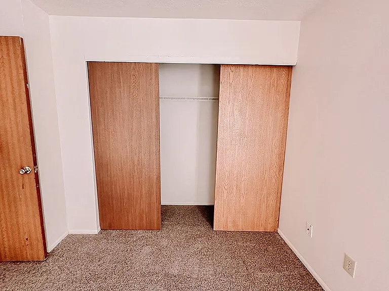 Bedroom with Wood Accent Doors