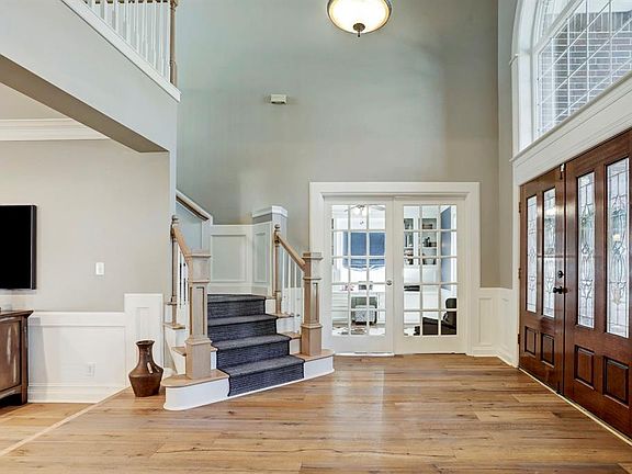 Another view of the foyer showng the office/study with fremch doors.