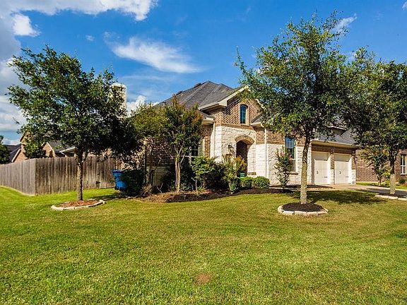 The home is ideally located on a large corner lot, minutes from neighborhood amenities and premier shopping, dining and entertainment.