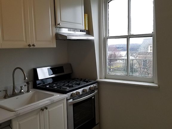 The windowed kitchen can be separated and closed off from the living room.