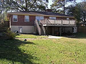 The home features an over-sized deck that overlooks a huge backyard.
