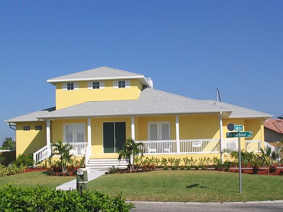 Street Front View showing Large Covered Front Porch and Landscaping.