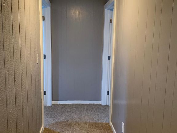 hallway to bedrooms from the tiled entry way