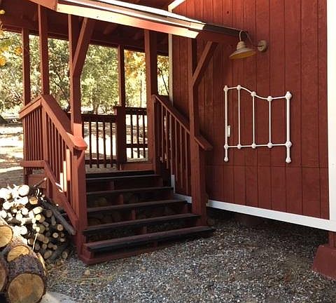 Stairs and covered walkway to the unit.