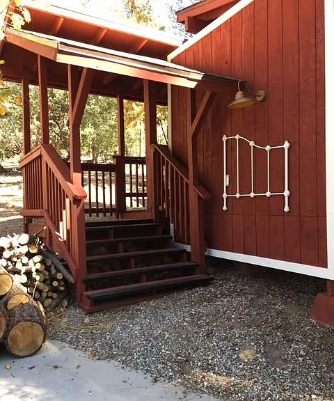 Stairs and covered walkway to the unit.