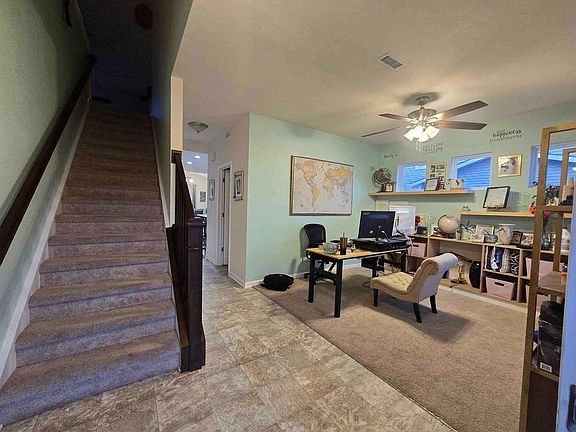 Entrance to home. Stairs and flex room on the right.
