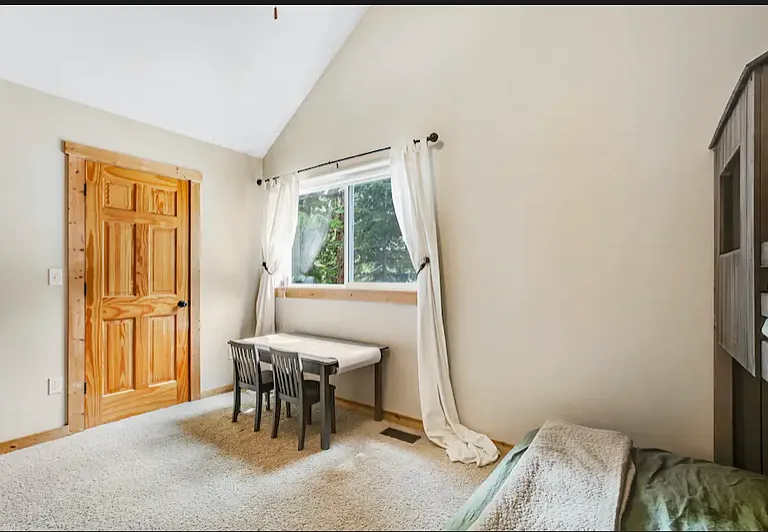large 2nd room with views of the door to the walk in closet