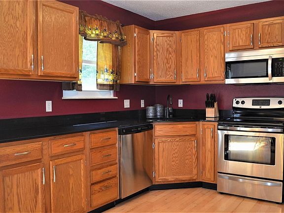 Gorgeous granite countertops and plentiful cabinets abound!