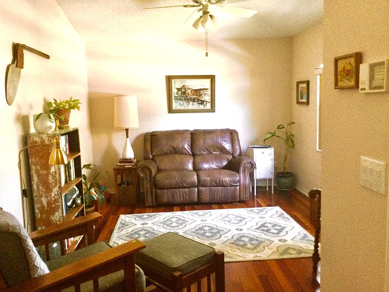 Living room with celling fan and hard wood floor