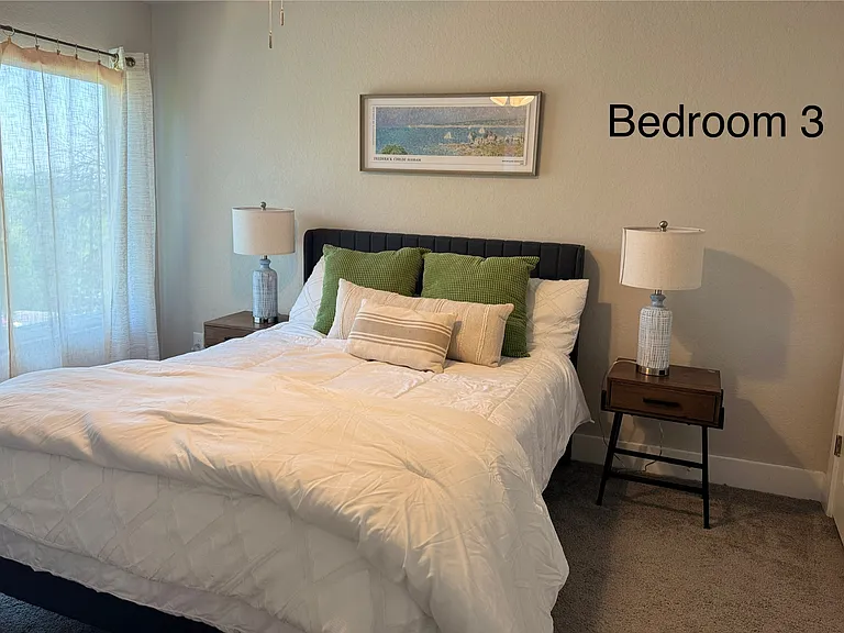 Bedroom 3 with queen bed, 32" ROKU TV, spacious closet and private ensuite bathroom