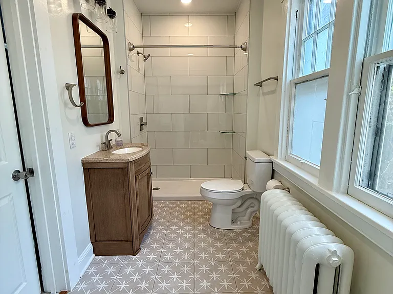 Brand new bathroom on the main floor with tile floor and spacious shower.