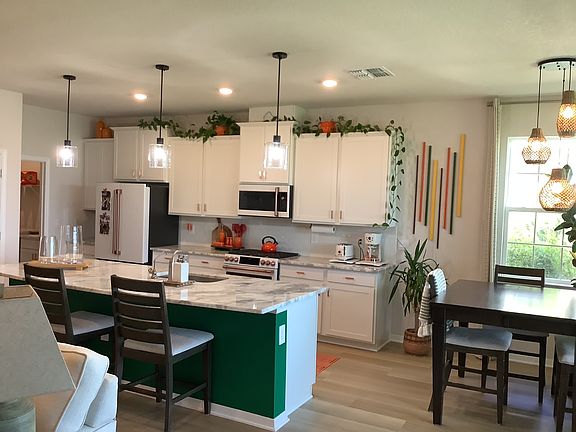 "Gourmet kitchen with gas stove and large island"