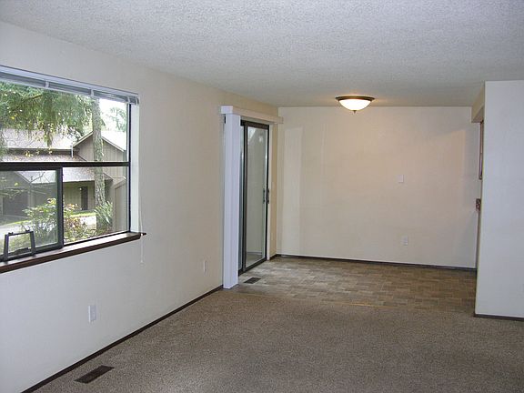 Living room, dining room, slider to patio.