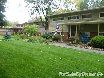 Lush, unique, four-season meandering perennial gardens, with lighting