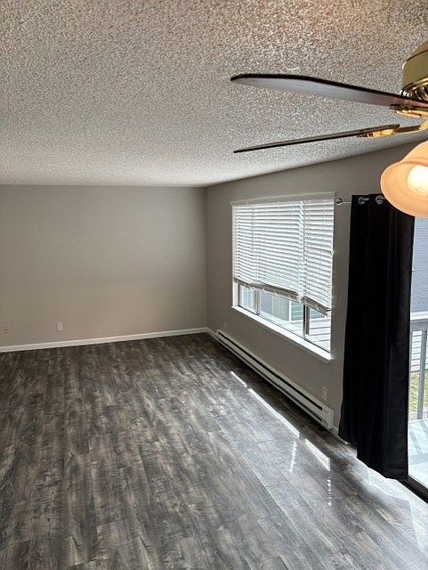 Large living/dining room area. 22 ft long 12 ft wide. New blinds