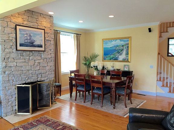 Great Room
						:
						Features living room, custom kitchen and dining area. Crown molding.